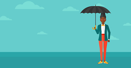 Image showing Business woman standing with umbrella.