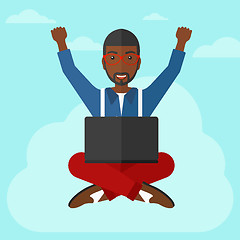 Image showing Man sitting on cloud with laptop.