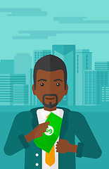 Image showing Man putting money in pocket.