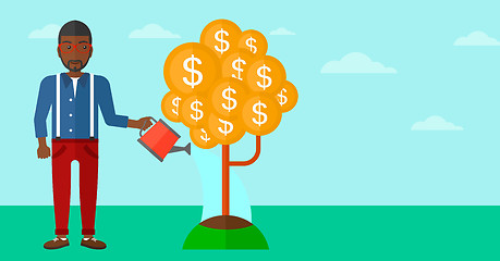 Image showing Man watering money tree.