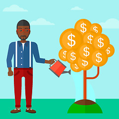 Image showing Man watering money tree.