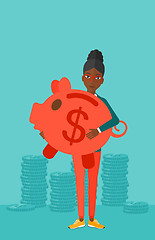 Image showing Woman carrying piggy bank.