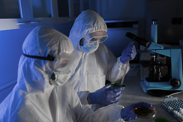 Image showing close up of scientists with test samples in lab