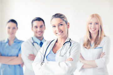 Image showing female doctor in front of medical group