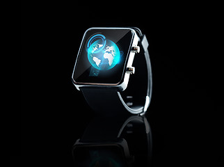 Image showing close up of smart watch with earth globe