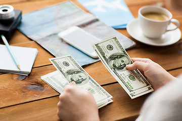 Image showing close up of traveler hands counting dollar money