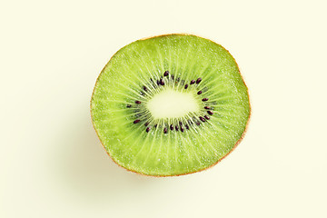 Image showing close up of ripe kiwi slice on table