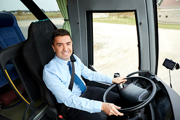 Image showing happy driver driving intercity bus