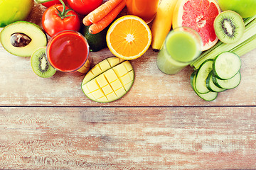 Image showing close up of fresh juice glass and fruits on table