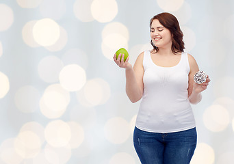 Image showing happy plus size woman choosing apple or donut