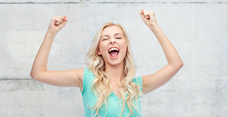 Image showing happy young woman or teen girl celebrating victory