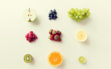 Image showing ripe fruits and berries on white surface