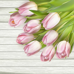 Image showing Color tulips on wooden background. EPS 10