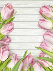 Image showing Bouquet of tulips on a wooden background. EPS 10