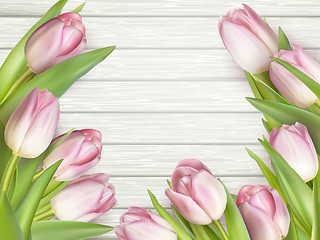 Image showing Pink tulips on wooden background. EPS 10