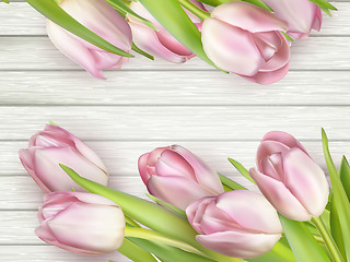 Image showing Bouquet of tulips on a wooden background. EPS 10