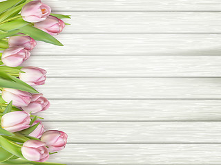 Image showing Pink tulips on wooden background. EPS 10