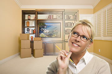 Image showing Female Holding Pencil In Room With Drawing of Entertainment Unit