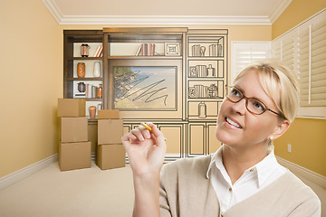 Image showing Female Holding Pencil In Room With Drawing of Entertainment Unit