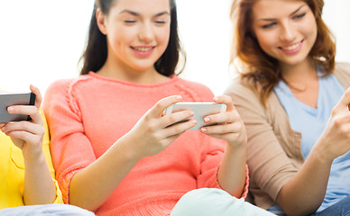 Image showing close up of women or friends with smartphones