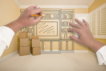 Image showing Hands Drawing Entertainment Unit In Room With Moving Boxes