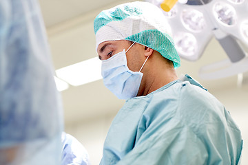 Image showing group of surgeons in operating room at hospital