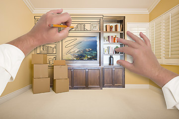 Image showing Hands Drawing Entertainment Unit In Room With Moving Boxes