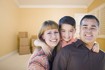 Image showing Young Mixed Race Family In Room With Moving Boxes