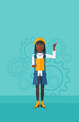 Image showing Woman standing on gears background.