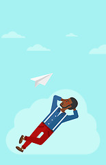 Image showing Businessman relaxing on cloud.