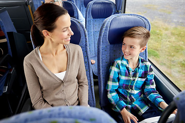 Image showing happy family riding in travel bus