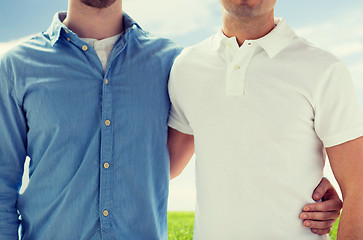 Image showing close up of happy male gay couple hugging
