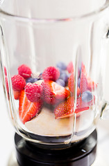 Image showing close up of blender shaker with fruits and berries