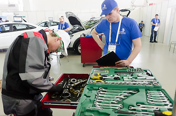 Image showing Young car mechanic passes competition stage.Tyumen