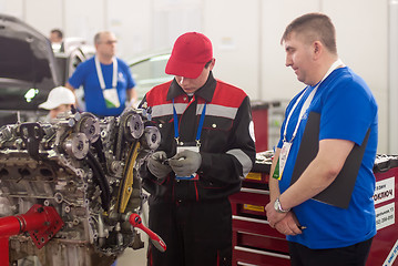 Image showing Young car mechanic passes competition stage.Tyumen