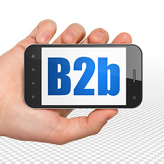 Image showing Finance concept: Hand Holding Smartphone with B2b on display