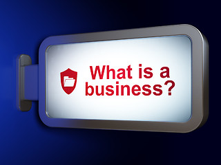 Image showing Business concept: What is a Business? and Folder With Shield on billboard background