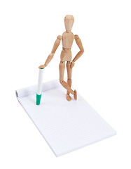 Image showing Wooden mannequin writing 