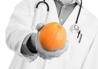 Image showing Nutritionist doctor, giving an orange, isolated