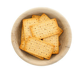 Image showing Simple crackers in a wooden bowl