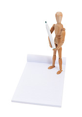 Image showing Wooden mannequin writing 