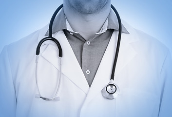 Image showing Close up of male doctor with stethoscope, medical blue