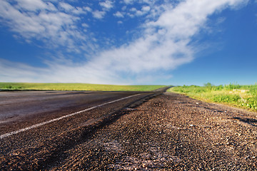 Image showing bad asphalt road in summer day