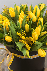 Image showing Bright spring bouquet of tulips and mimosa flowers