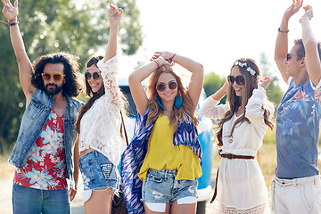 Image showing happy young hippie friends dancing outdoors