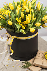 Image showing Bright spring bouquet of tulips and mimosa flowers