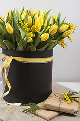 Image showing Bright spring bouquet of tulips and mimosa flowers