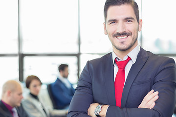 Image showing Team leader with coworkers working in office.