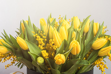 Image showing Bright spring bouquet of tulips and mimosa flowers