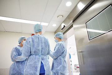 Image showing group of surgeons in operating room at hospital